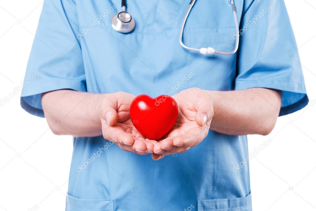 depositphotos_49311957-stock-photo-cardiology-surgeon-holding-heart-shape