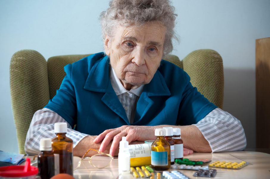 Senior woman with her medicine bottles