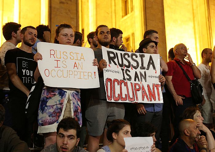 Protesters hold a rally against a Russian lawmaker's visit in Tbilisi