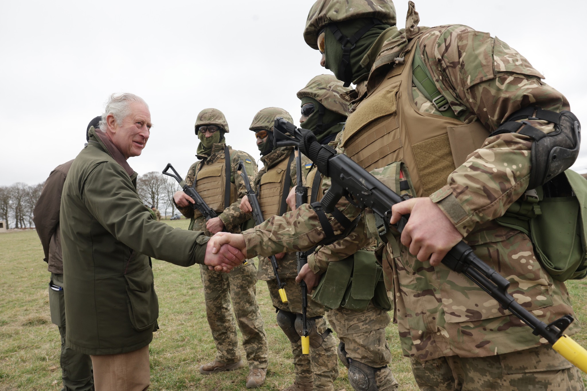 King Charles III meets with Ukrainian recruits during a visit to a training site for Ukrainian military recruits, in Wiltshire, where recruits are completing five weeks of basic combat training by British and international partner forces, before returning to fight in Ukraine. Picture date: Monday February 20, 2023.