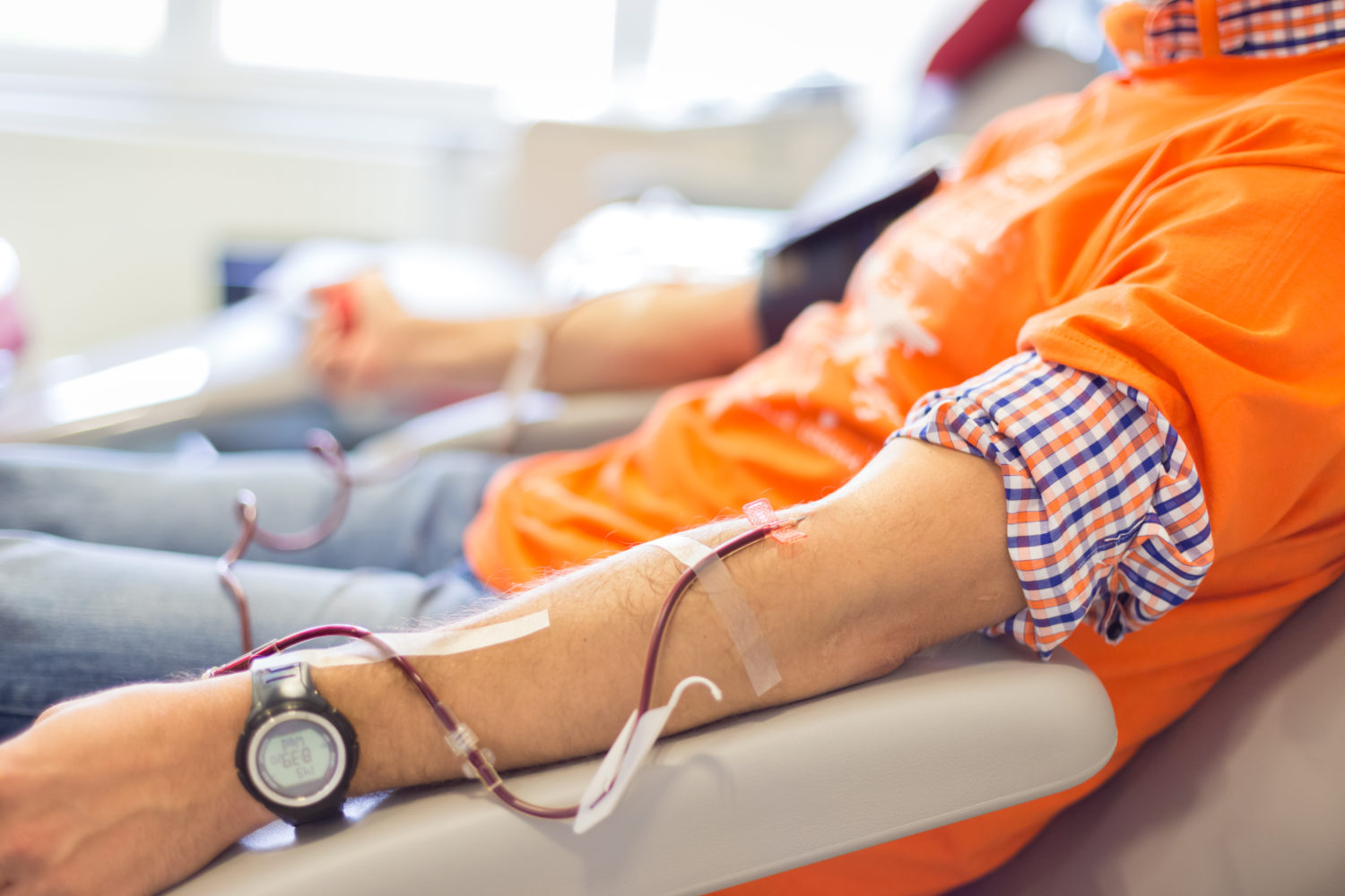 Blood donor at donation.