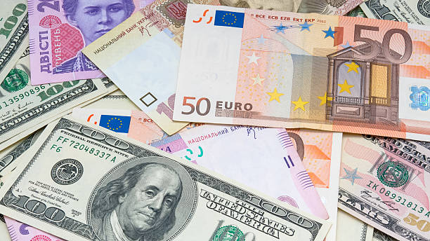 Different banknotes (dollar, euro, hryvnia) make money background