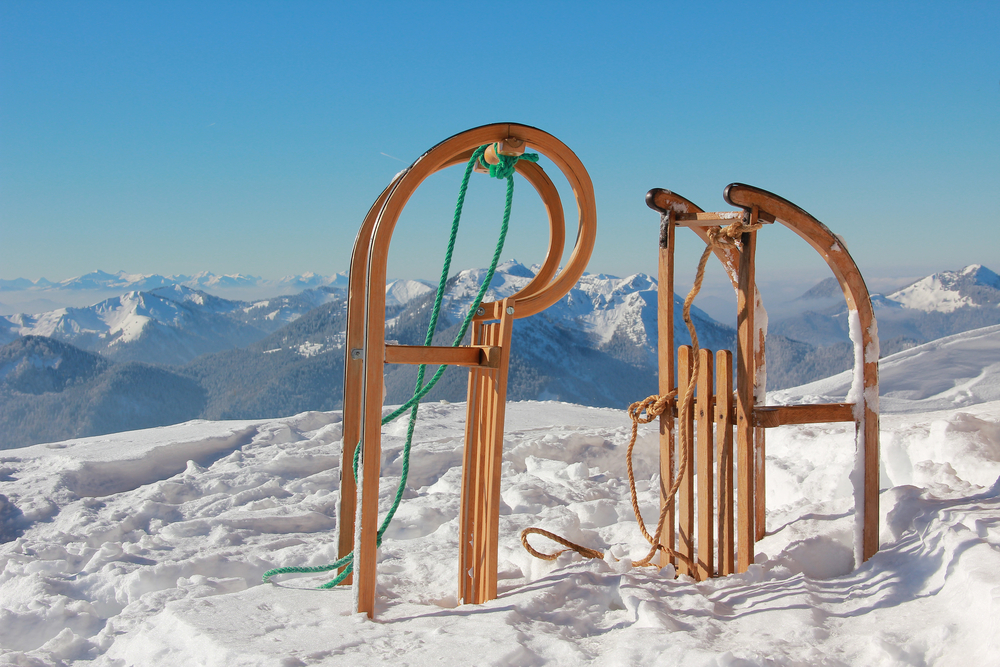 two sleds and wintry mountain range