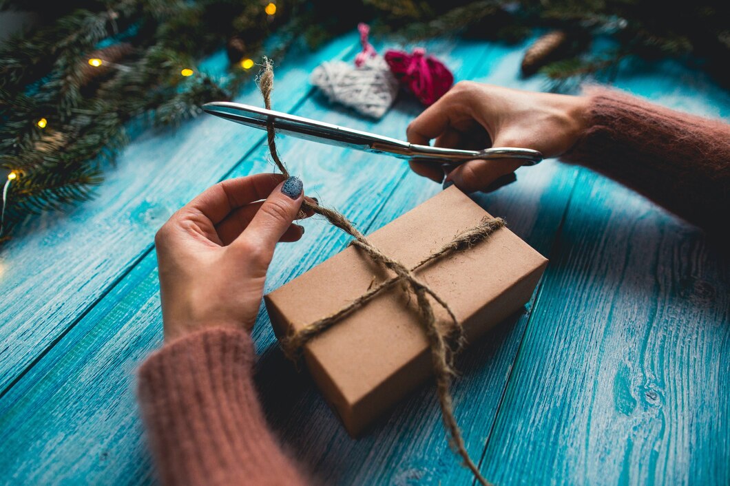 christmas-items-blue-wooden-table-woman-s-hands-wrapping-christmas-gift_8353-6523