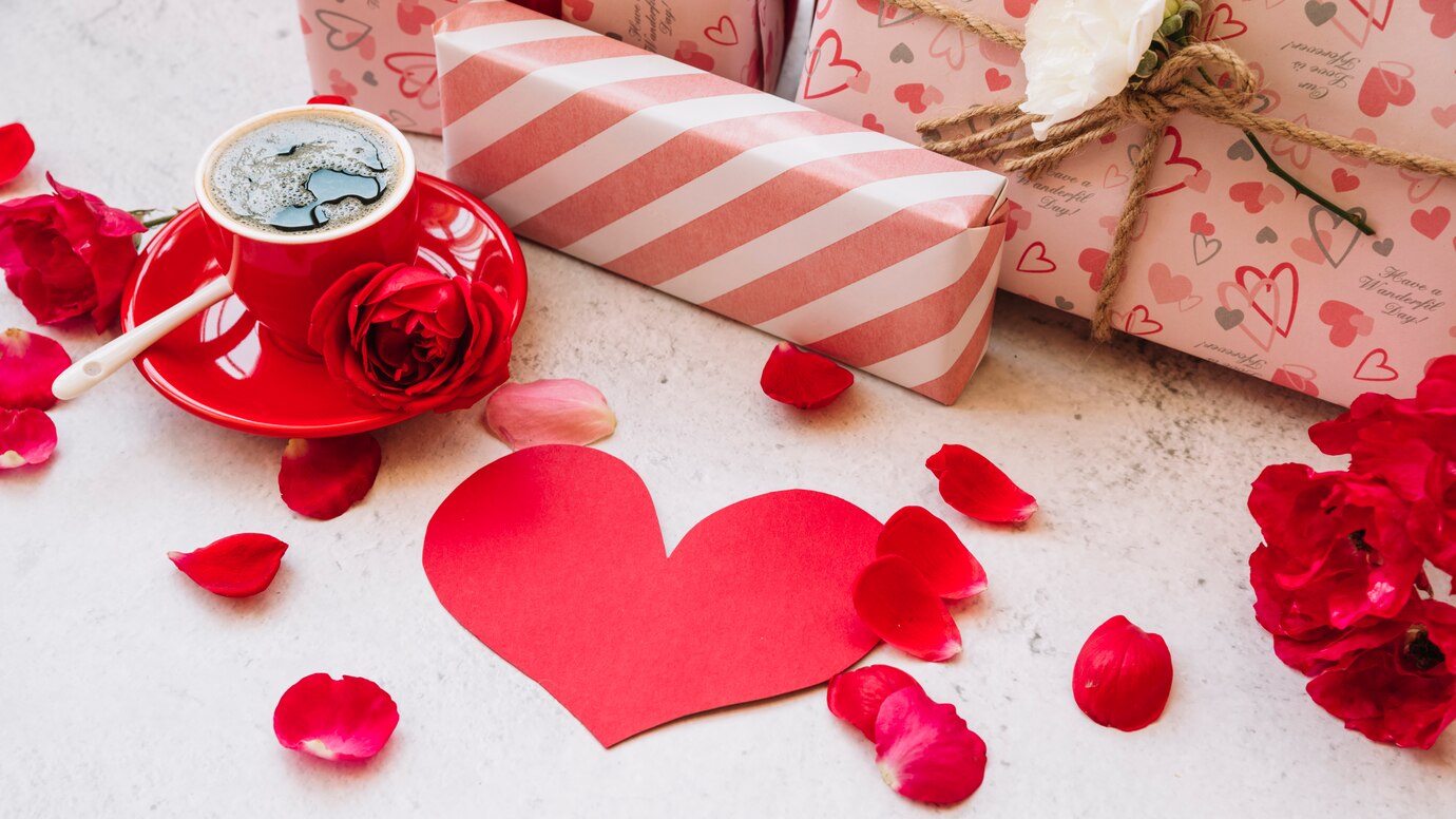 gift-boxes-wrap-near-flower-petals-paper-heart-cup-with-drink_23-2147990896