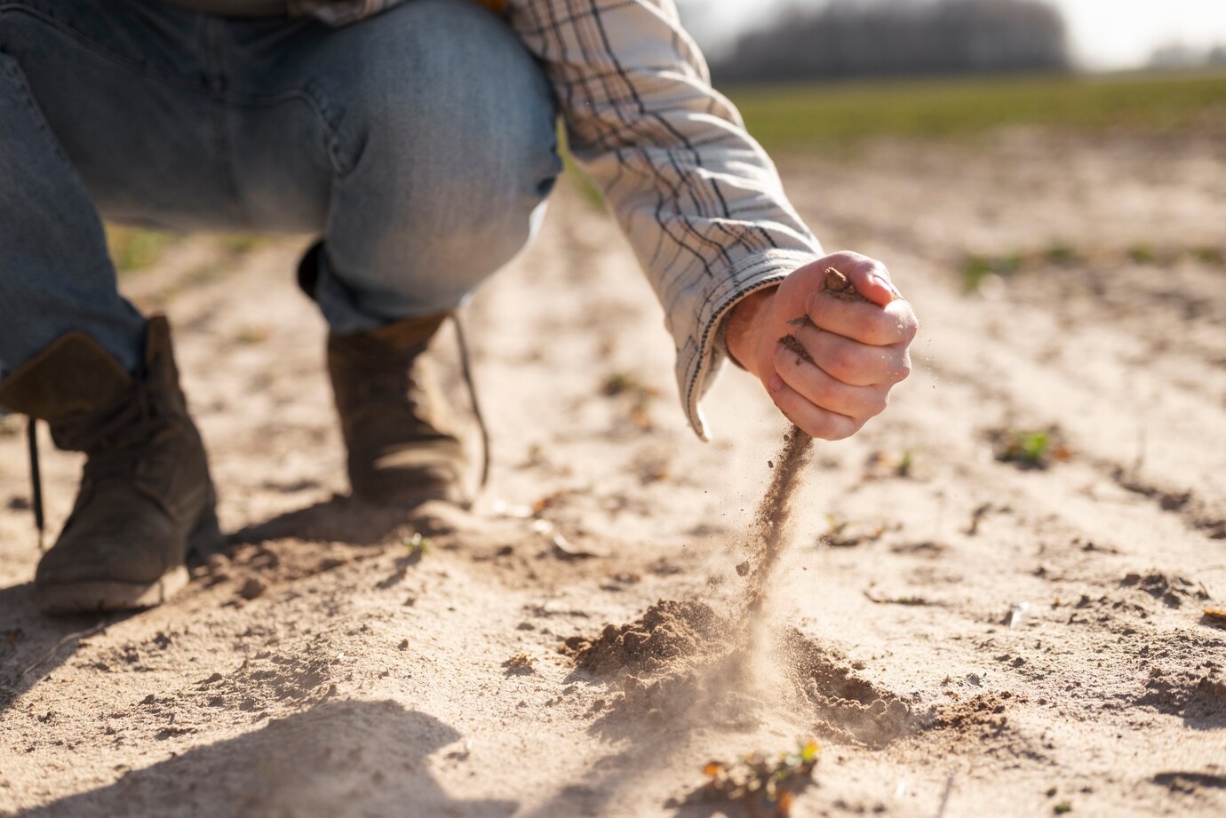 hand-holding-sand-rural-lifestyle_23-2149382200