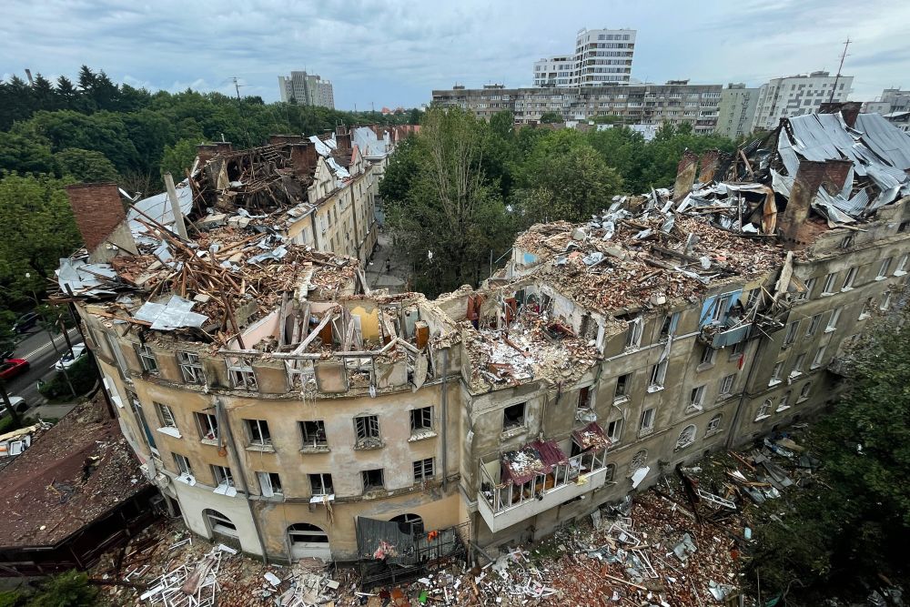 a building with debris on the ground